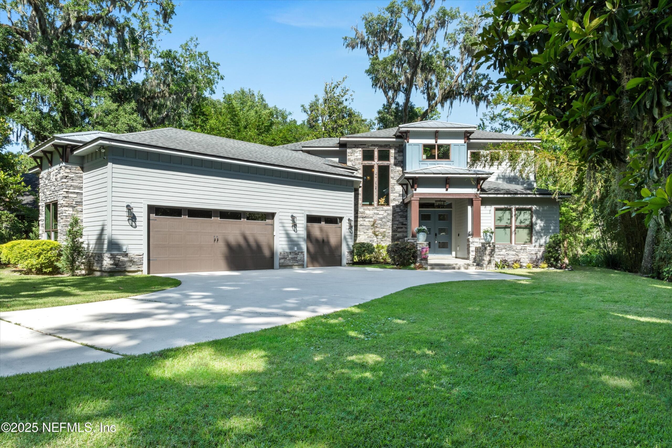 Rental single-family home in Fleming Island with tree-lined driveway